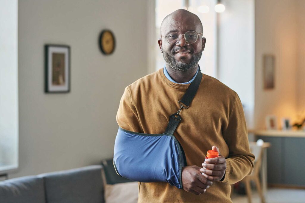 Man smiling because he got help from an injured at work attorney.