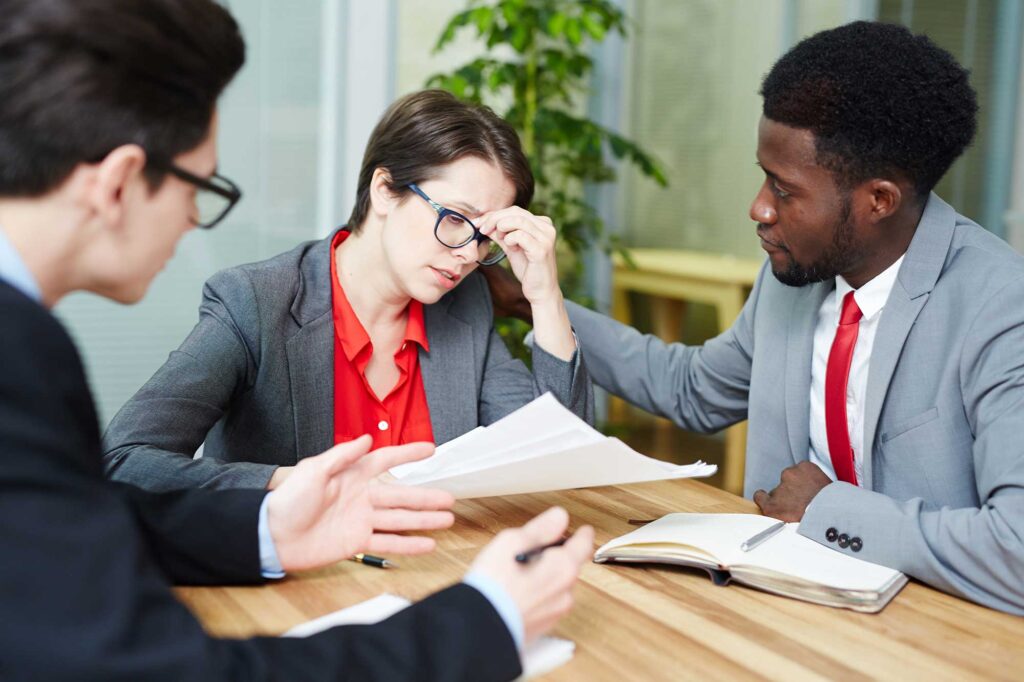 Lady injured at work meeting with attorney.