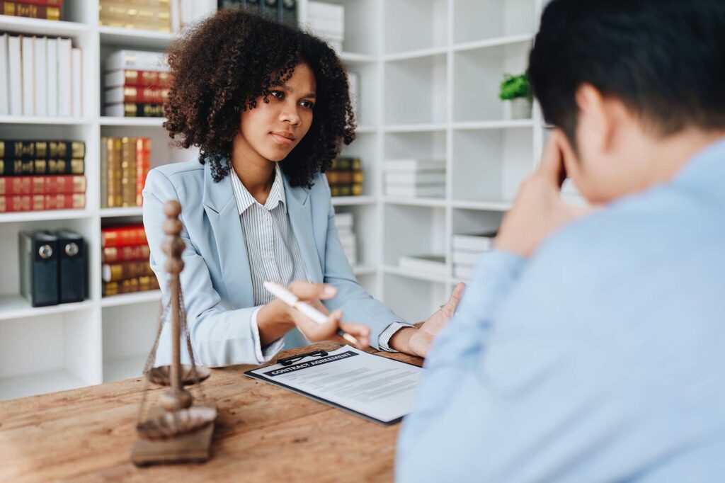 Grieving man in Georgia meeting with a personal injury attorney.