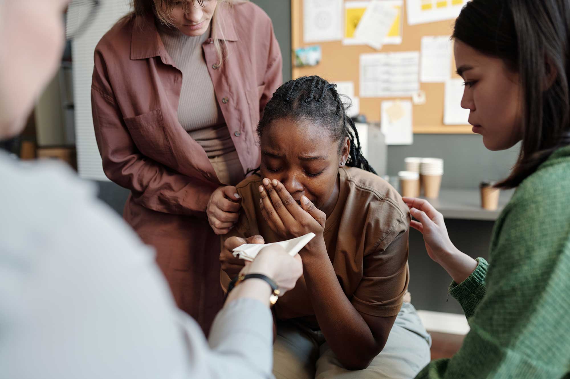 Grieving woman after finding out family's wrongful death.