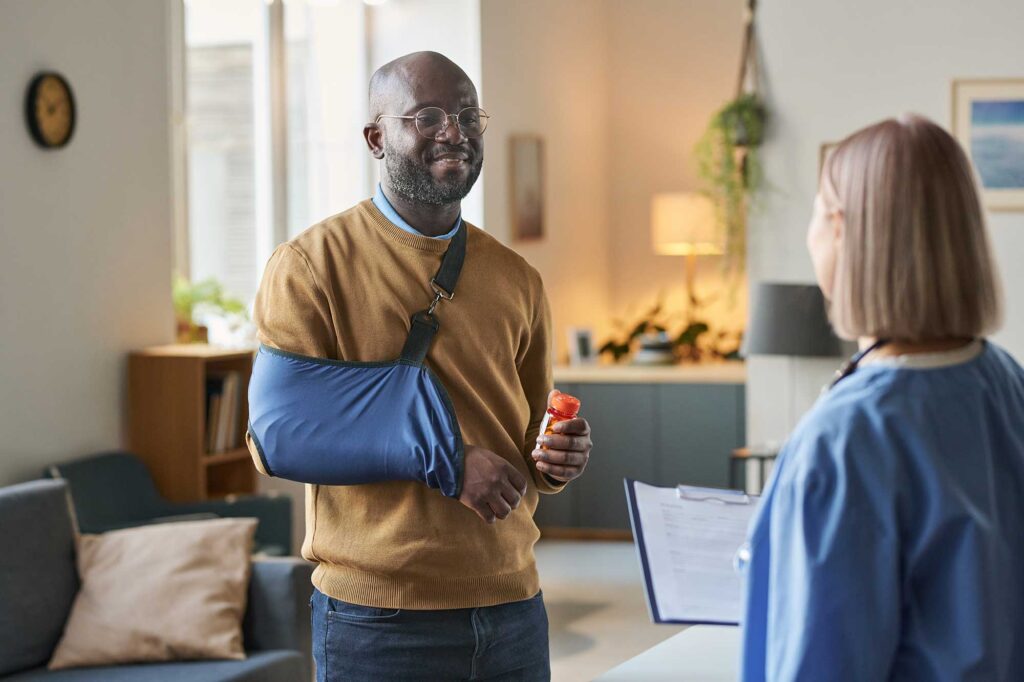 Man suffering from a personal injury meeting with doctor.