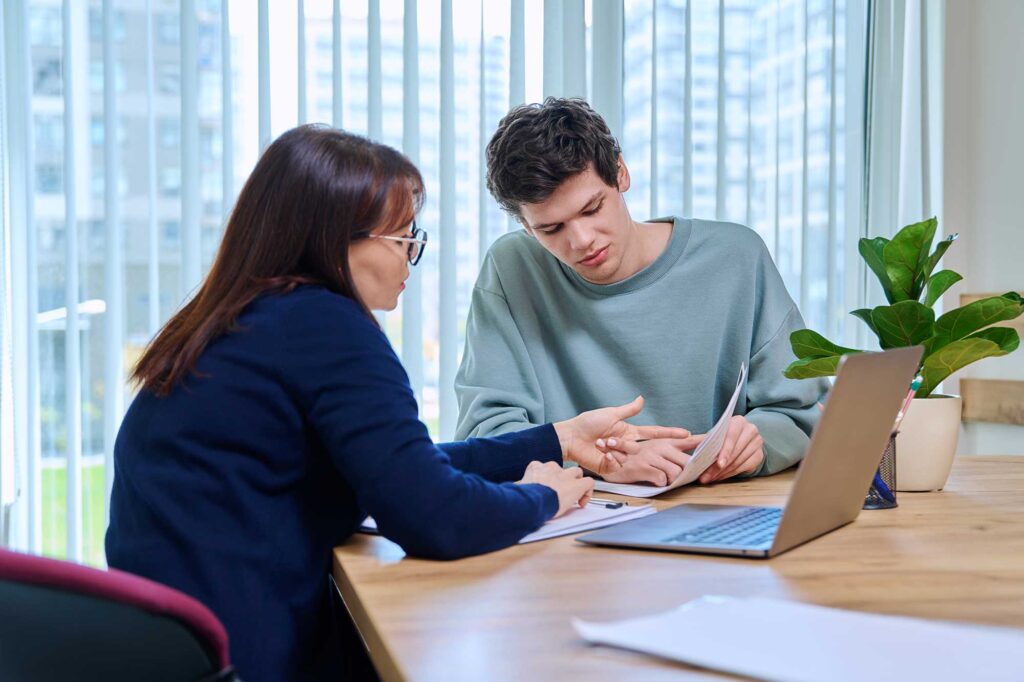 Young man in Georgia meeting with a personal injury attorney.