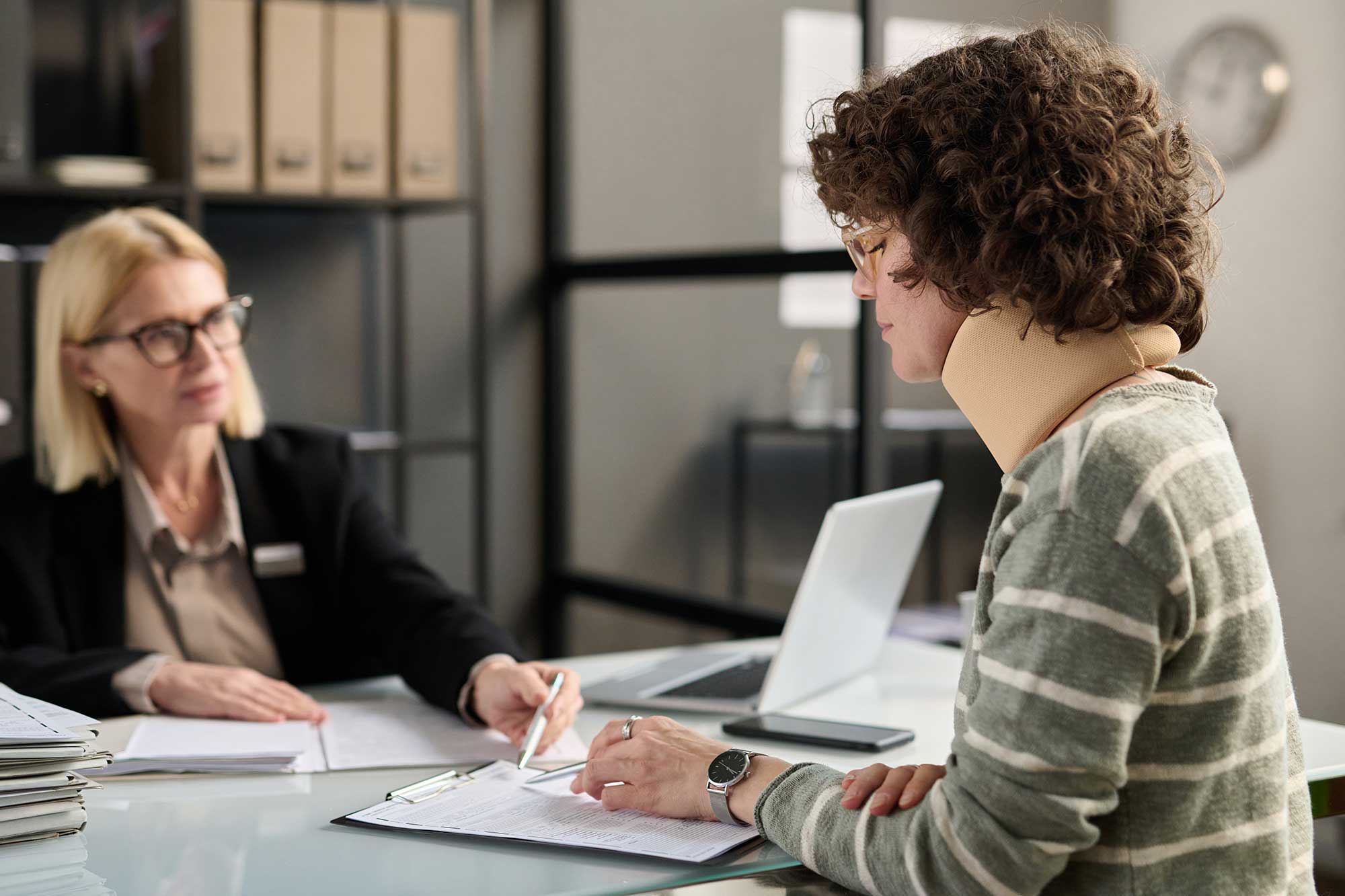 Woman in Georgia meeting with a personal injury attorney.