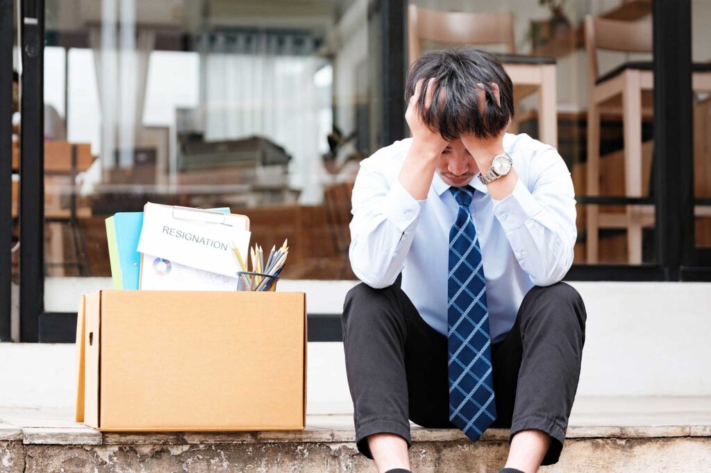 Man is distressed from wrongful termination, considering suing employees. 